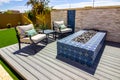 Two Arm Chairs And Table By Ceramic Tile Fire Pit