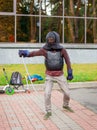 Two armed men lead a sword fight, a medieval fight, at a fun medieval tournament. Sports competitions