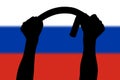 two arms bending police tonfa rubber stick silhouette and blurry russian flag in the background
