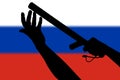 two arms with police tonfa rubber stick silhouette and blurry russian flag in the background