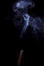 Two aroma sticks for relaxation with smoke on a black background for the aroma of different smells Royalty Free Stock Photo