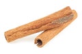 Two aromatic dried cinnamon sticks isolated on white background. Cassia Royalty Free Stock Photo