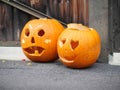 Two artistically carved pumpkin lantern for Halloween