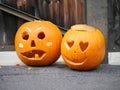 Two artistically carved pumpkin lantern for Halloween