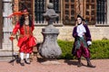 Two artists wearing venetian costumes and masks, Brussels Floralia