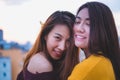 Two asia lesbian lgbt couple at roof top party in sunset evening