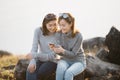 Two Asia woman Friends using smart phone Royalty Free Stock Photo