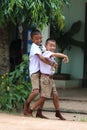 Two Asian boys are playing to enjoy together.