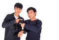 Two Asian boys are pointing to each other. Royalty Free Stock Photo