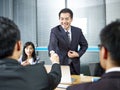 Asian business men shaking hands before meeting Royalty Free Stock Photo