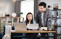 Two asian business partners having working meeting at office Royalty Free Stock Photo