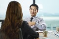 Two asian business people having a discussion in office Royalty Free Stock Photo