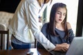 Two Asian business women using notebook working and Discussion of the important contract at office Royalty Free Stock Photo