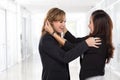 Two asian businesswomen fighting Royalty Free Stock Photo