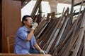 Two asian carpenters in a construction workshop. business man and woman working together woodwork