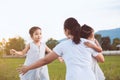 Two asian child girls running to their mother to give a hug Royalty Free Stock Photo