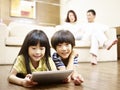 Asian children using digital tablet Royalty Free Stock Photo