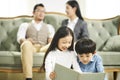 Two asian children reading book together Royalty Free Stock Photo