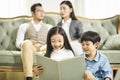 Two asian children reading book together Royalty Free Stock Photo