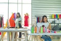 Two Asian clothing designers are working in the office Royalty Free Stock Photo