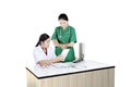 Two asian female doctor using tablet computer