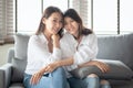 Two asian females take a portrait photo with charming smile