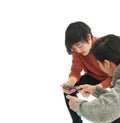 Two close Asian friends sharing application and information on mobile phone