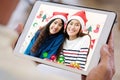 Two asian girl video call to family for greeting in Christmas celebration, Senior man hand holding digital tablet while talking