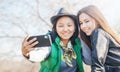 Two Asian girlfriends teen girls 15 16, New technology trends and friendship concept Royalty Free Stock Photo