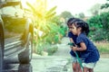 Two asian girls helping parent washing a car Royalty Free Stock Photo