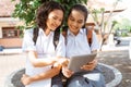 two asian high school students using a tablet together Royalty Free Stock Photo