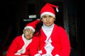 Two Asian Indian Ethnicity kids wearing Santa Hat waving having Royalty Free Stock Photo