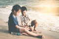 Two kids is helping up cleaning the enviroment on the Beach Royalty Free Stock Photo