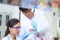 Two Asian Laboratory scientist working at lab with test tubes Royalty Free Stock Photo