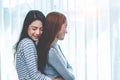 Two Asian Lesbian women hug and embracing together in bedroom. Couple people and Beauty concept. Happy lifestyles and home sweet