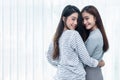 Two Asian Lesbian women looking together in bedroom. Couple people and Beauty concept. Happy lifestyles and home sweet home theme