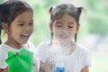 Two asian little child girls help parent to clean window Royalty Free Stock Photo