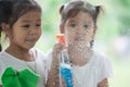 Two asian little child girls help parent to clean window Royalty Free Stock Photo