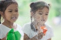 Two asian little child girls help parent to clean window Royalty Free Stock Photo