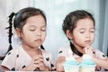 Two asian little child girls make folded hand to wish Royalty Free Stock Photo