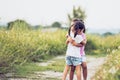 Two asian little girls hugging each other with love Royalty Free Stock Photo