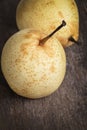 Two asian pears on old wooden table Royalty Free Stock Photo