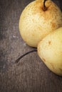 Two asian pears on old wooden table Royalty Free Stock Photo