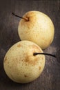 Two asian pears on old wooden table Royalty Free Stock Photo