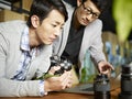 Two asian photographers at work Royalty Free Stock Photo