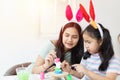 Two asian sisters painting colorful water color on concrete dall Royalty Free Stock Photo