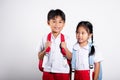 Two Asian student kid girl boy schoolchildren brother sister smile happy wear student thai uniform Royalty Free Stock Photo