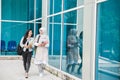 Two asian student walking on campus Royalty Free Stock Photo