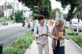 Two asian student walking together go to campus Royalty Free Stock Photo