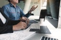 Two asian team working development of programming and encryption technology website design programmers on desk in office Royalty Free Stock Photo
